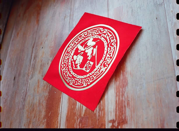 Photography: Luck in red and gold – Shot on Kodak VISION3 250D 5207 at EI 250 (35mm format)