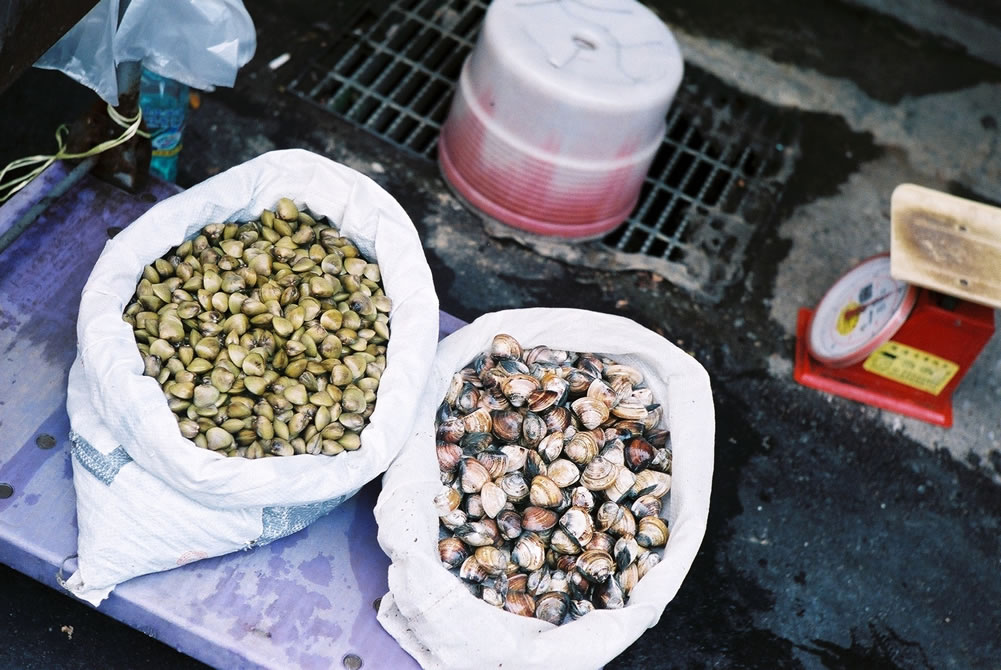 By the sack - Fuji Pro 400H shot at EI 200. Color negative film in 35mm format. Over exposed by one stop.