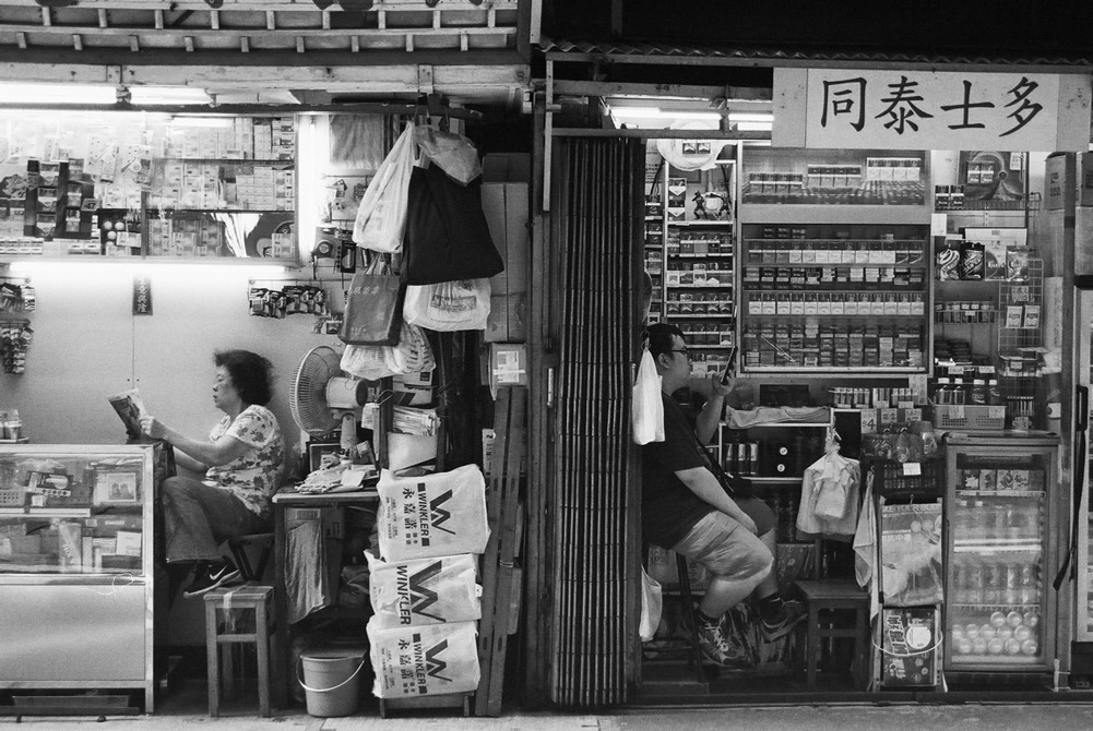 Photography: Generational distractions – Shot on Fuji Neopan 400 at EI 400 (35mm format)