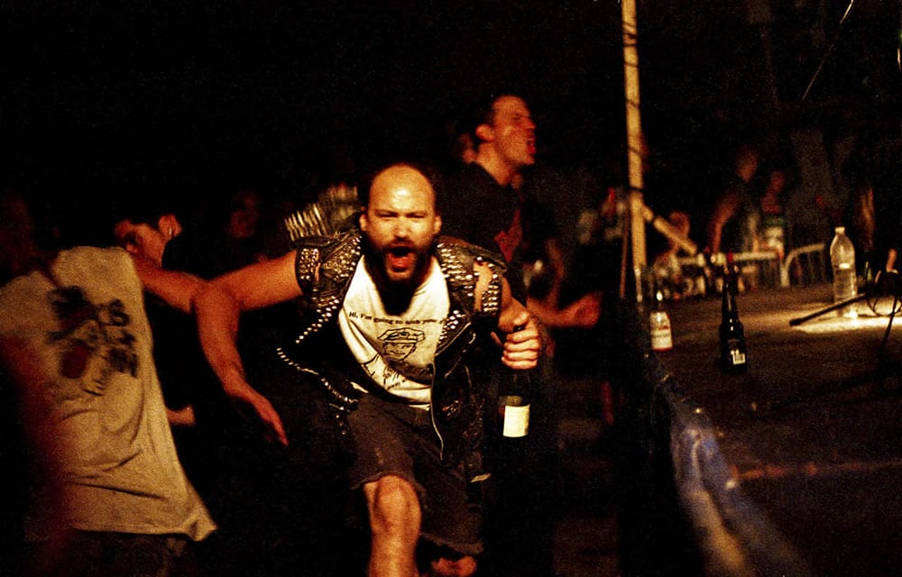Fattal Fest - A brief moment of connection in a dark and chaotic mosh pit at an underground punk festival in Montreal's Saint-Henri neighborhood. Canon F-1, Agfa Vista 400 Plus at EI 1600
